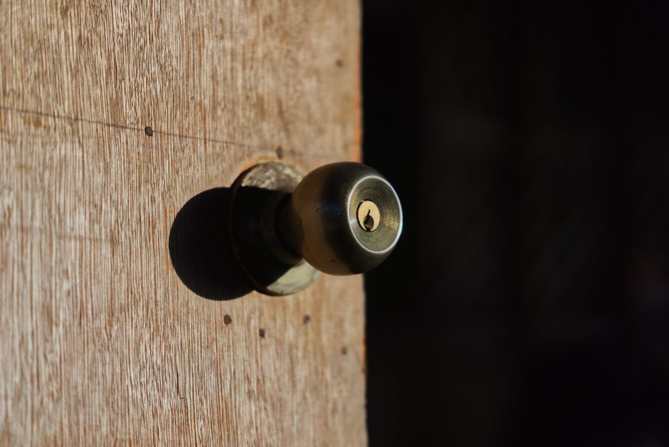 Brass door knob lock indicating high security